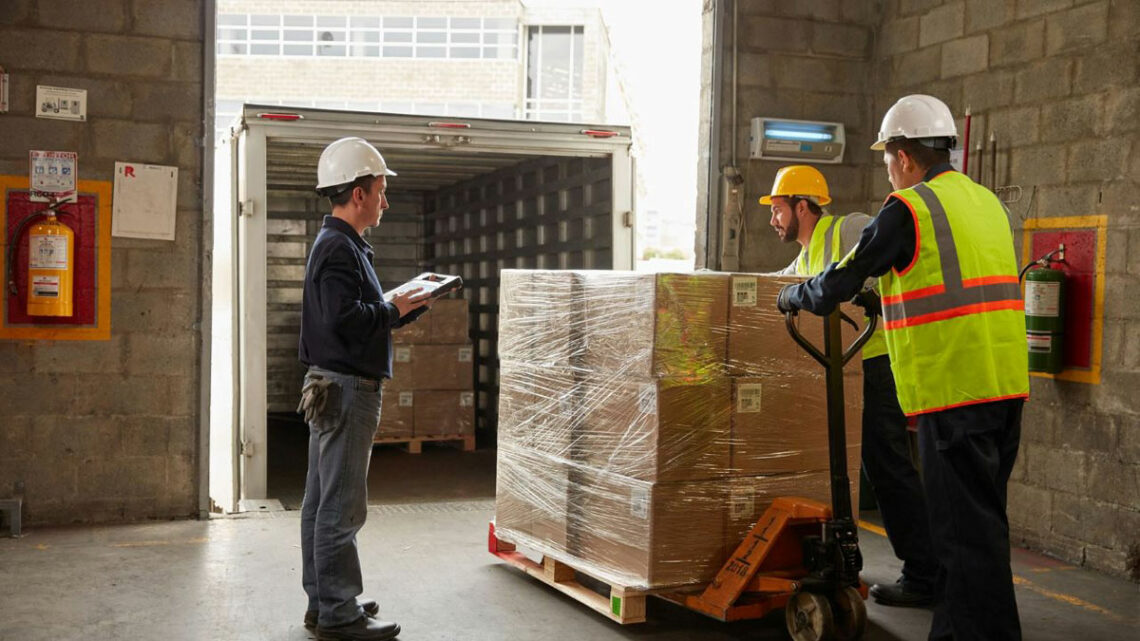 Using a Zebra Tablet While Loading a Pallet into a Delivery Truck