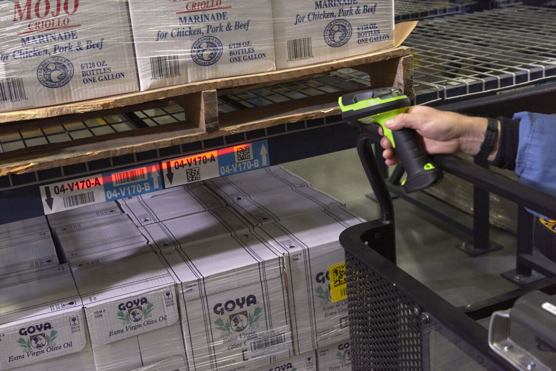 Zebra's DS3600 scanning a barcode under a pallet in a warehouse
